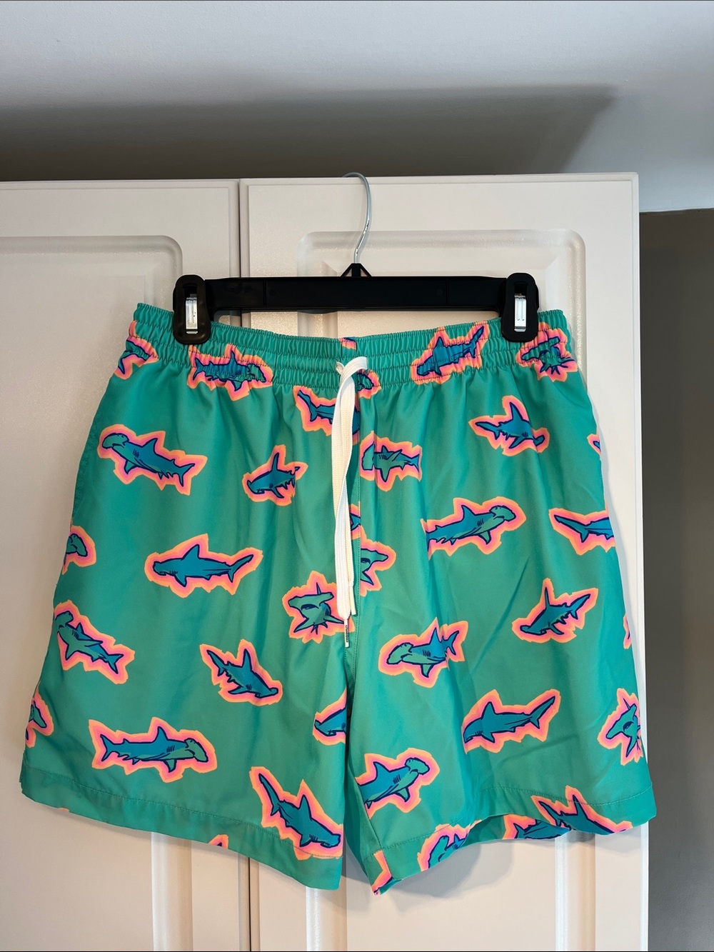 Men’s Chubbies Teal Shark Print Swim Shorts. Size L, 5.5” inseam